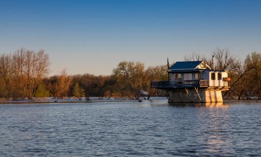 This cabin on a concrete foundation, similar to that of an old lighthouse, is fully surrounded by water in the spring.